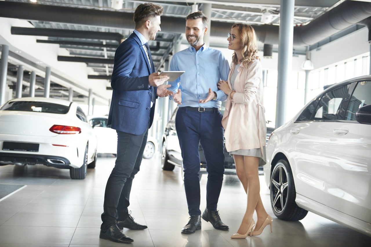 couple purchasing brand new car